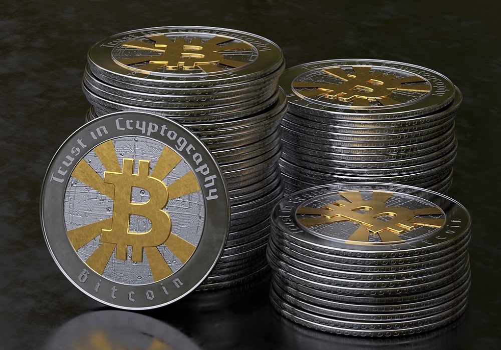 Könnten die Energiewirtschaft dezentralisieren: Bitcoins, hier in einer materialisierten und deswegen eigentlich unnötigen Variante. Foto: MasterTux / Pixabay
